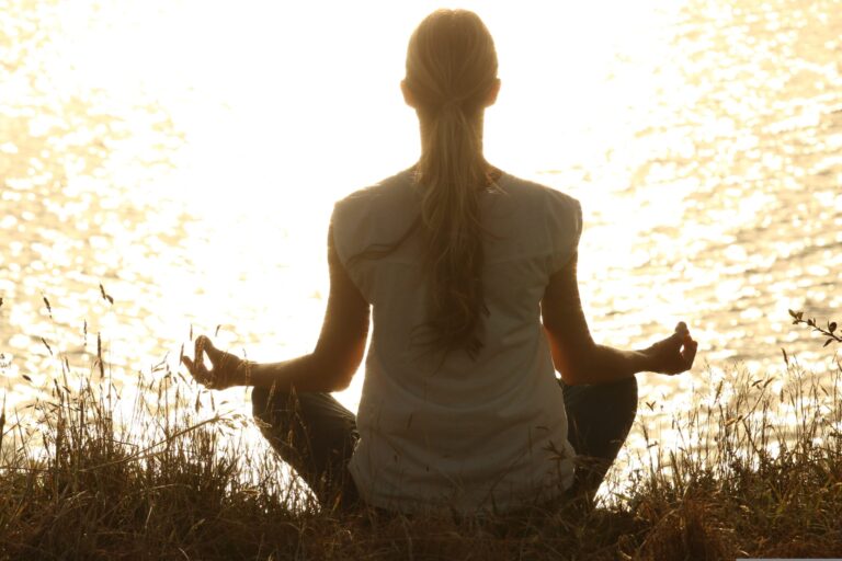 Person meditating, featured image for the "Best Natural Remedies for Vertigo and Dizziness" article