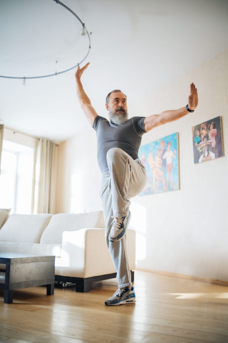 Older man performing a balance exercise, featured image for the "Best Balance Exercise Programs for Seniors" article